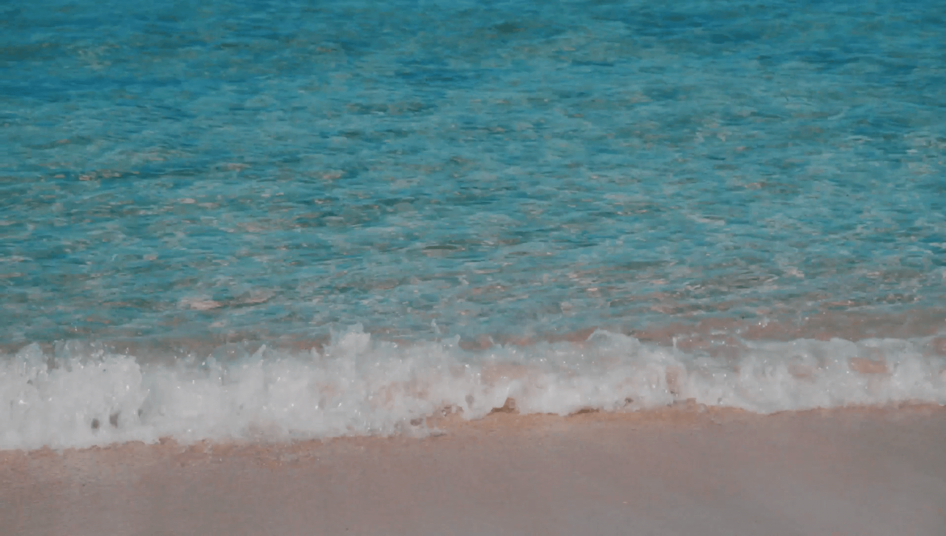Calming waves along the beach